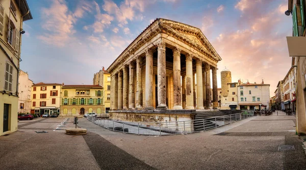 Panoramic view of the ancient Roman Temple of Augustus and Livia in Vienne city's Old town center square, France. The corinthian style temple is one of the best preserved roman temples in Europe.