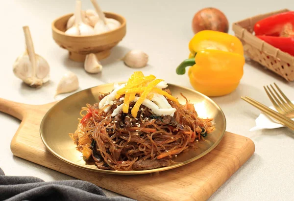 Japchae Korean Cuisine Glass Chapchae Noodles Dish with Vegetables and Meat. Asian Traditional Food, Korean Authentic Meal.
