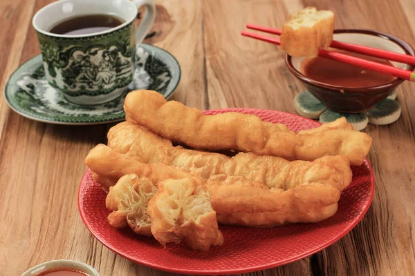 Cakwe or Chinese Oil Stick Fried Bread (You Tiao), Deep Fried Snack Served with Tea