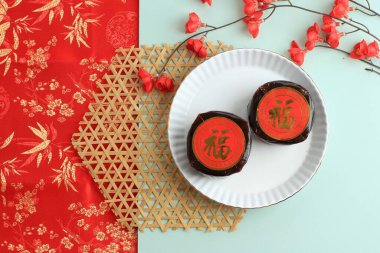 Chinese New Year Cake Popular as Kue Keranjang or Dodol China in Indonesia, Chinese Character is Fu Means Fortune clipart