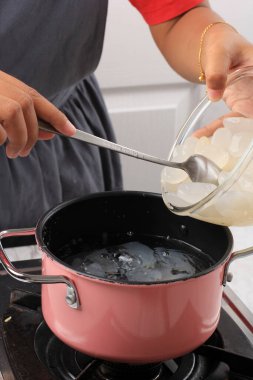 Boliling Sugar Palm Fruit or Kolang Kaling, Process making Ramadan Desser, Manisan Kolang Kaling with Sugar Syrup