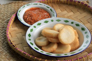 Selected Focus Ulen Ketan, Indonesian Traditional Snack Made from Steam Sticky Rice, Compressed or Shaped and then Deep Fried, Served with Sambal Oncom