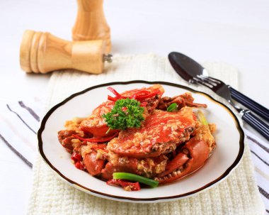 Chilli Mud Crab, Crab with Singaporean Sauce, Special Singapore Cuisine. Served on White Plate
