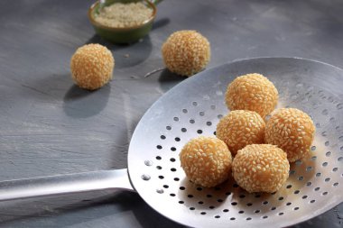 Selected Focus Onde onde, Indonesian Traditional Snack Made from Sticky Rice Flor Stuffed with Mung Bean Paste and Garnish with Sesame Seed. Copy Space for Text