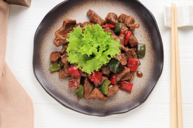Chinese Cuisine Stir Fried Beef with Black Pepper and Paprika. Top View on White Background