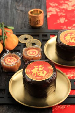 Nian Gao also Niangao a Sweet Rice Cake, a Popular Dessert Eaten During Chinese New Year. It was Originally Used as an Offering in Ritual Ceremonies. Chinese Character Means Fortune clipart