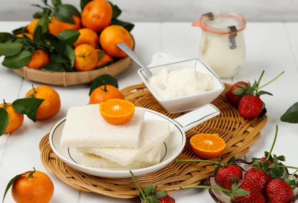 Ingredient Making Fruit Sandwich or Japanese Fruit Sando, WHite Bread, Whip Cream with Fresh Fruit, on White Table