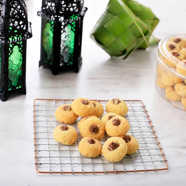 Thumb Print Chocolate Cookies, Homemade for Celebrating Hari Raya. On White Table