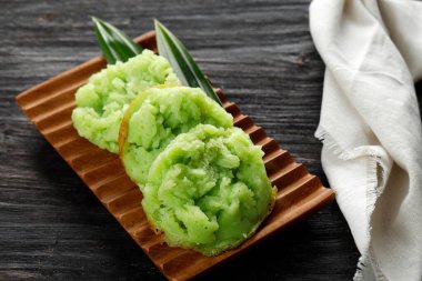 Kue Bikang or Carabikang, Indonesian Traditional Cake, One Varian of Jajanan Pasar. Bikang  is Made From Rice Flour Dough and Coconut Milk clipart