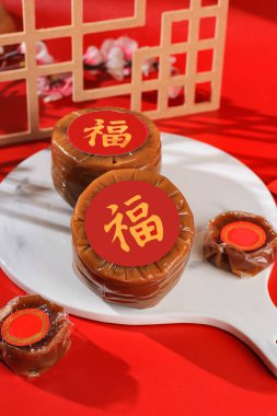 Nian Gao also Niangao a Sweet Rice Cake, a Popular Dessert Eaten During Chinese New Year. It was Originally Used as an Offering in Ritual Ceremonies. Chinese Character Means Fortune clipart