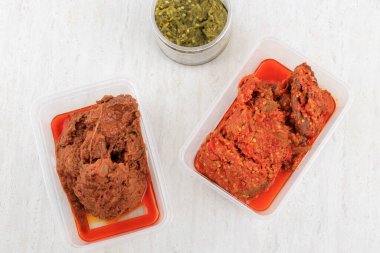 Top View Rendang and Dendeng Balado with Sambal Ijo (Green Chilli Sauce or Sambalado), Frozen Food Preparation for Suhoor or Sahur  clipart