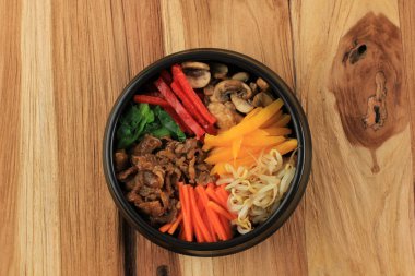 Bibimbap, Korean Spicy Salad with Rice Bowl, Traditionally Korean Food Style. Top View 