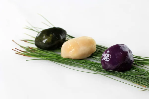 stock image Three Songpyeon, Half-moon Shape Korean Rice Cake for Chuseok Day with Pine Needle Leaf. Isolated on White Background