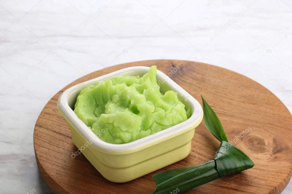 Bubur Sumsum Ijo Pandan is Sweet Porridge Traditional Indonesian Snack, Made from Rice Flour, Served with Palm Sugar Sauce and Garnished wit Pandanus Leaves. Popular during Ramadan Breakfasting
