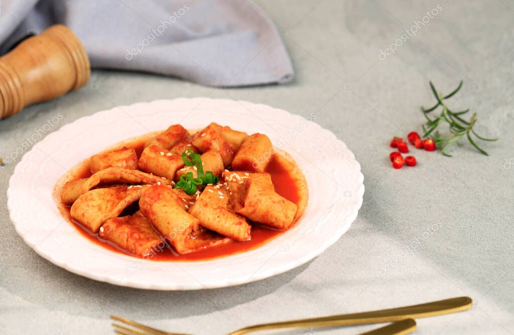 Odeng Korean Fish Cake with Topokki (Tteokbokki) on Pink Plate, Copy Space for Text