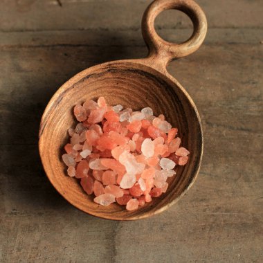 Spoon of Pink Himalayan Salt on Wooden Table, Close Up 