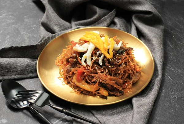 Japchae Korean Cuisine Glass Chapchae Noodles Dish with Vegetables and Meat. Asian Traditional Food, Korean Authentic Meal. Copy Space for Text