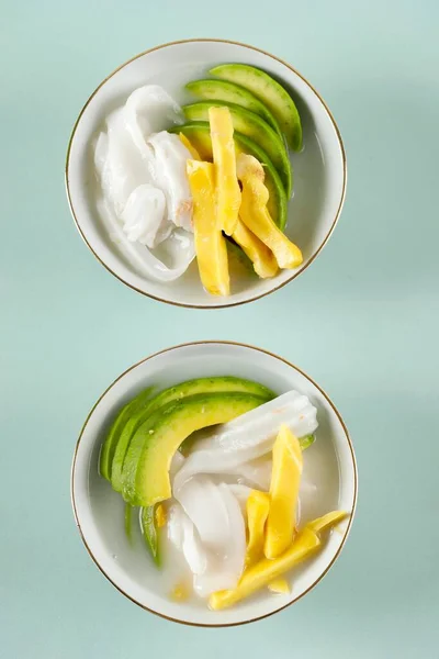 Es Teler 77 or Es Teller, Indonesian Fruit Cocktail from Consist of Avocado, Young Coconut, Jackfruit, Served with Coconut Milk and Swetened with Condensed Milk. Top View