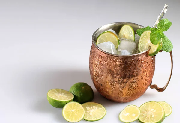 Moscow Mule Ice Cold Cocktail Copper Cup Lime Mint White — стокове фото