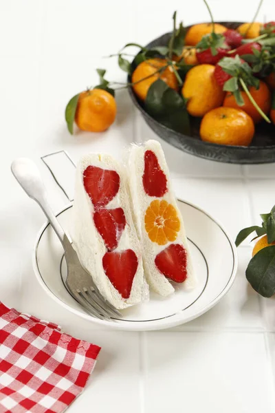 Japanese Fruits Sandwich Furutsu Sando with Strawberry and Orange on White Wooden Background, Messy Styling