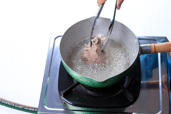 Woman Hand Boiled Beef Pan White Table — Stockfoto