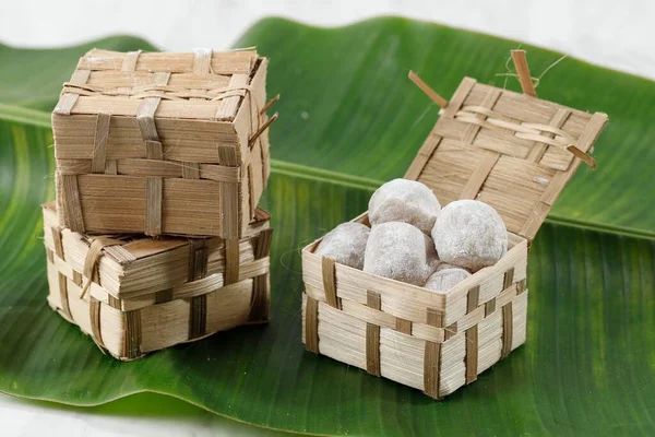 Mochi Lampion Sukabumi, Chewy Rice Cake with Peanut Inside on Bamboo Packaging. Sustainable Eco Packaging Concept