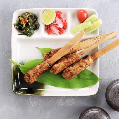 Top View Sate Lilit, Delicious Traditional Indonesian Balinese Culinary, Minced Seafood Satay Made from Tuna Fish and Other Spicy Ingredients.