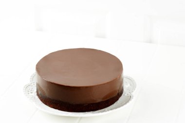 Chocolate Brownie Pudding, Two Layer Chocolate Cake on White Plate. Copy Space Concept White Bakery