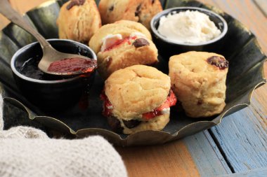 British Scones with Clotted Cream and Strawberry Jam for Afternoon Tea Time, Close Up