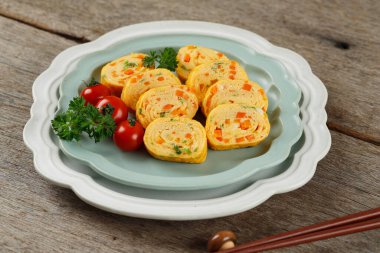 Tamagoyaki or Japanses Egg Roll. Gyeran Mari or Korean Rolled Omelette, Telur Dadar Gulung. Selective Focus 
