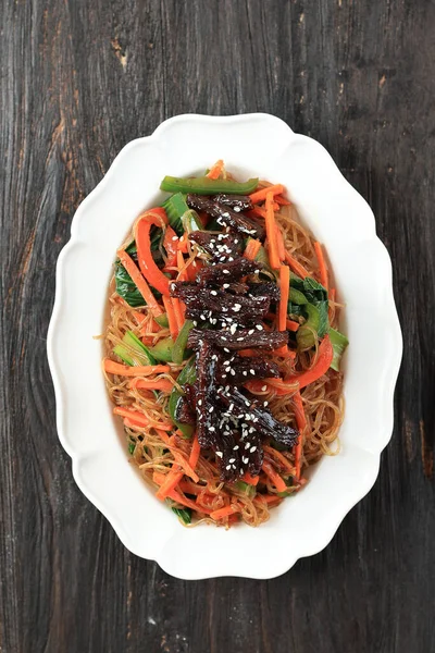 Japchae, Chap Chae Korean Noodle Dish with Beef Bulgogi Topping,  Top View