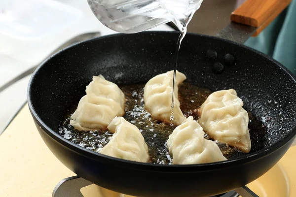 Pour Water Process Cooking Steamed Gyoza, Step by Step in the Kitchen. Cooking Gyoza using Fry Pan