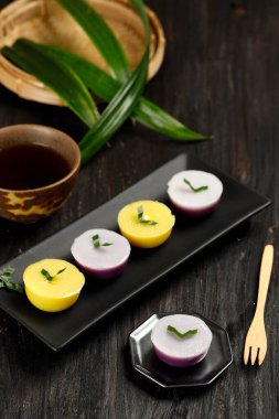 Kue Talam or Kue Nona Manis, Indonesian Traditional Cake Mde from Rice FLour and Coconut Milk, Steamed in a Plastic Cup. Selected Focus 