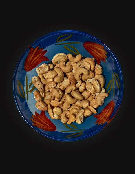 Roasted Whole Cashews Glass Blue Bowl Light Brown Nuts Used — Zdjęcie stockowe