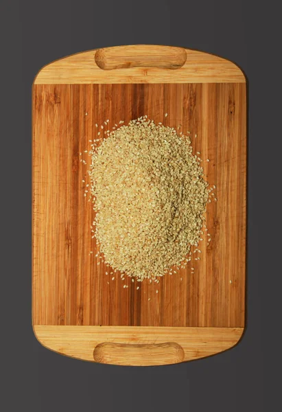 Small Handful Sesame Seeds Wooden Board Isolated Black Background — Stock Fotó