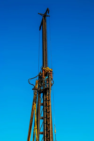 Hydraulic drilling rig. Installation of bored piles with a casing string. Foundations and grounds. Drilling in the ground. technology. Machine for drilling holes in the ground.