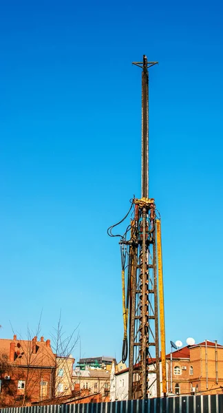 Hydraulic drilling rig. Installation of bored piles with a casing string. Foundations and grounds. Drilling in the ground. technology. Machine for drilling holes in the ground.