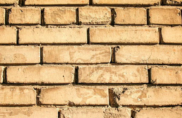Old brick wall background, brick wall texture, structure. old broken brick, cement joints, close-up. Construction, repair. Concept of devastation, decline.
