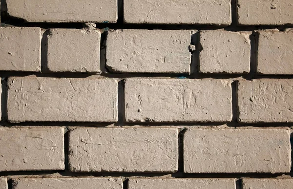 Old brick wall background, brick wall texture, structure. old broken brick, cement joints, close-up. Construction, repair. Concept of devastation, decline.