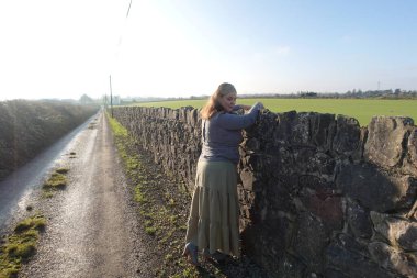 Lady in the country road