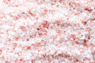 Himalayan salt texture and background for design. Close up of pink salt. Top view.
