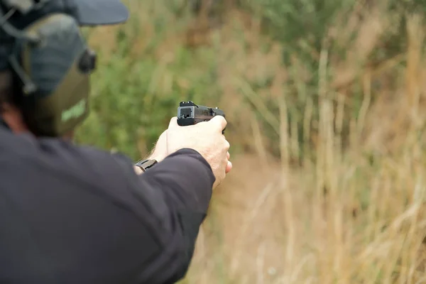 Man Holds Gun His Hands Pistol Shooting Exercises — 스톡 사진