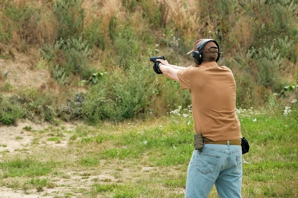 Man Holds Gun His Hands Pistol Shooting Exercises — Stockfoto