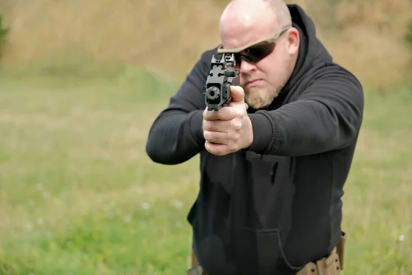 Man Threatens Combat Pistol Man Holding Gun His Hands — Stok fotoğraf