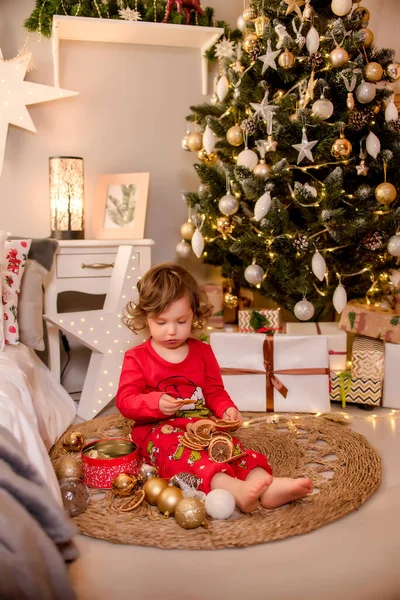 a child opens a Christmas present. christmas in scandinavia style