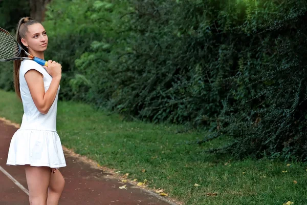 Girl White Sports Dress Stands Tennis Court Holds Racket Portrait — Foto de Stock