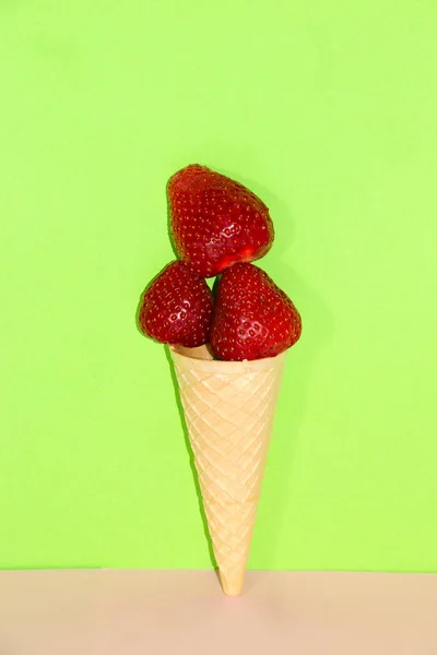 ice cream with strawberries, creative art design on a green pink background, copy space healthy dessert