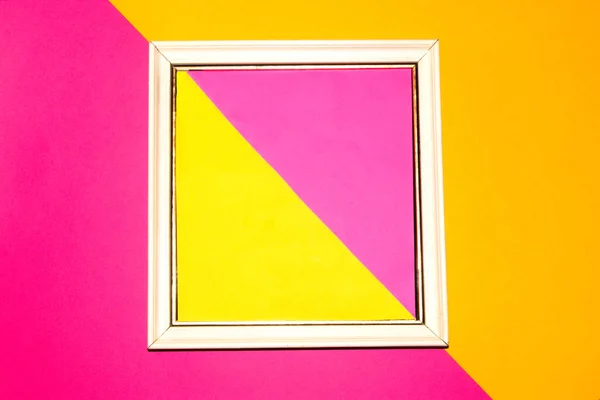 white retro frame with yellow-pink background around the frame pink-yellow background, creative retro modern summer design, copy space