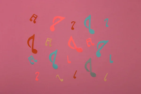 colorful music notes on a pink background, creative music design