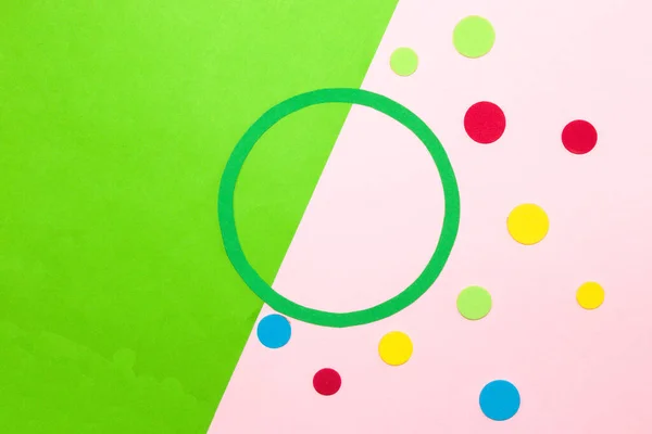 green circle on pink-green background as copy space, around colorful dots, creative art design, product space, marketing